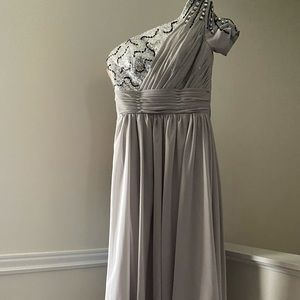 Beautiful Gown it was worn as a prom dress it has a lovely thick lining. Size 0